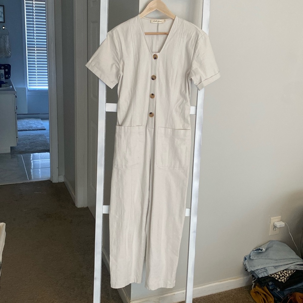 Cream Jumpsuit with pockets and working buttons
